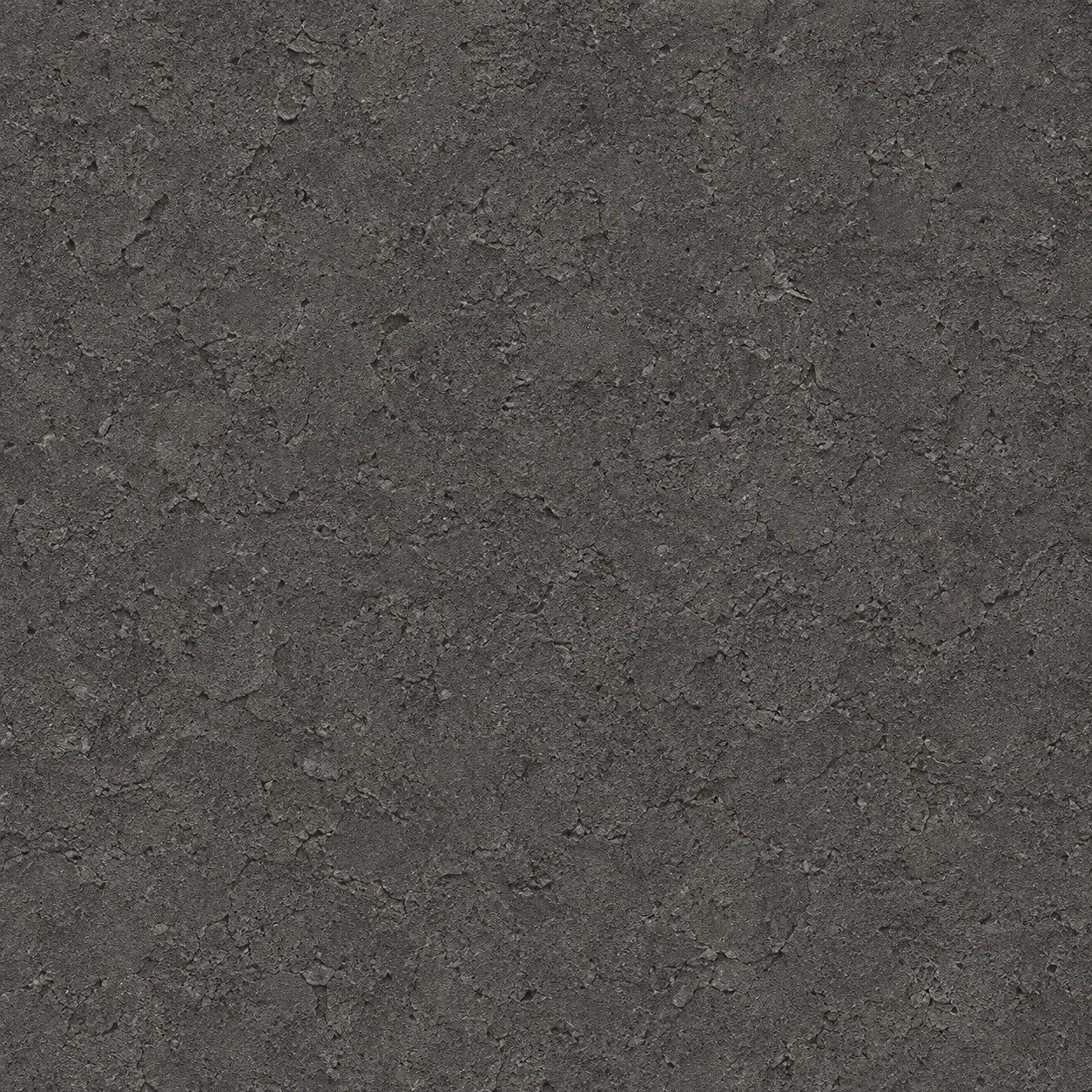 A deep graphite surface with a fine granular texture.